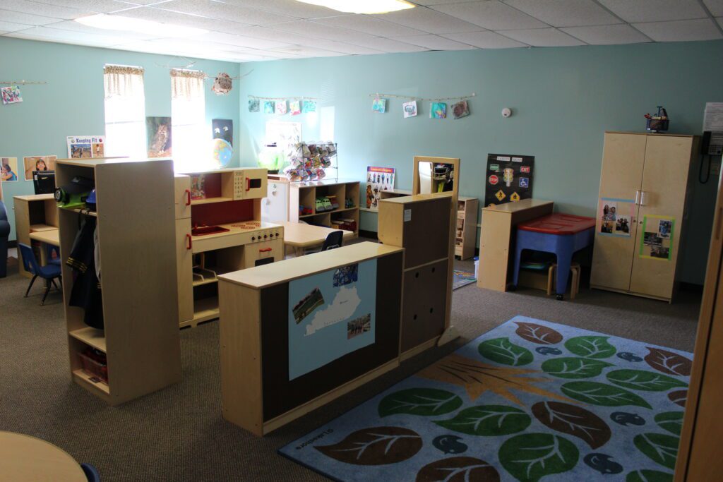 Preschool classroom that is well arranged with clearly divided learning centers.
